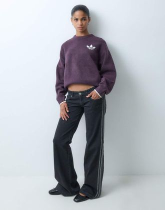 adidas Originals pantaloni in denim a gamba svasata a vita bassa in true black denim-Nero