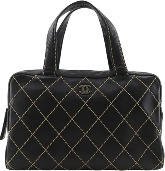 Chanel Surpique Boston Quilted Leather Black Leather Handbag (Pre-Owned)