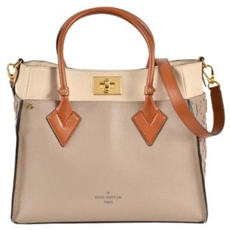 Louis Vuitton Tweedehands leren Louis Vuitton tassen - Dames - Pre-owned - Beige - Maat: ONE Size Leer