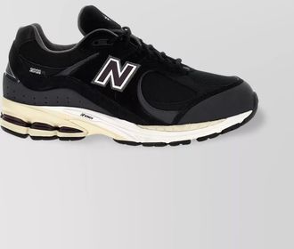 New Balance 2002 sneakers with mesh panels and reflective accents