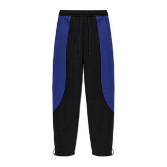 Nike Pantalones de forro polar Tech con bloques de color y dobladillo abierto - Sport - Hombre - Negro - 2XL