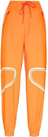 adidas by Stella McCartney logo-print lightweight track pants - women - Recycled Polyester - S - Orange