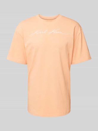 Karl Kani T-Shirt mit Rundhalsausschnitt in Orange, Gr&ouml;&szlig;e S