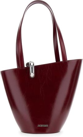 Jacquemus le Bambola Moyen Bordeaux Shoulder Bag With Front Metal Ring Closure And Embossed Logo Lettering On The Front In Leather