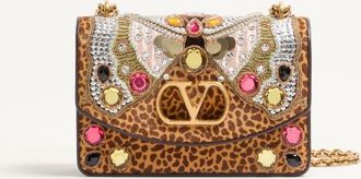 Valentino Garavani Valentino Garavani Vain embroidered shoulder bag in pony-effect calfskin. Wo