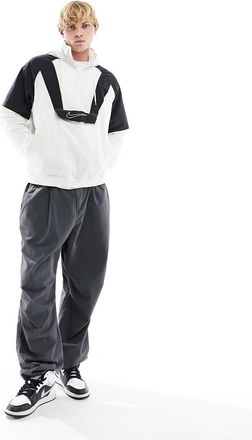 Nike woven panel half zip jacket in black and white