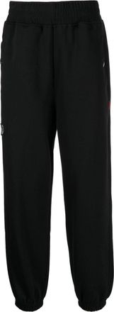 Izzue logo-patch track pants - men - Cotton/Polyester - 32 - Black