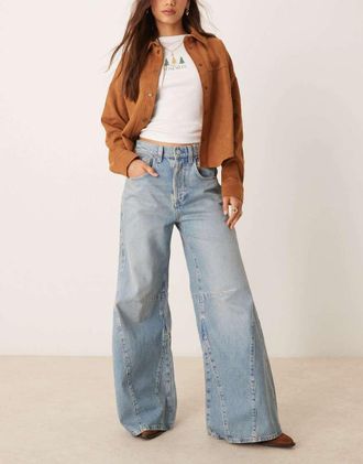 Free People Eden high waist slouchy flared jeans in mid wash blue