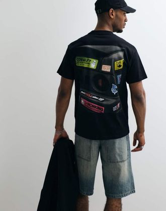 Carhartt Work in Progress T-shirt nera con stampa di auto da bumper sul retro-Nero