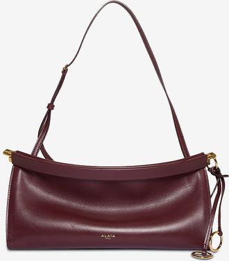 Alaia Schultertasche aus glänzendem Glattleder Le Click East West Medium