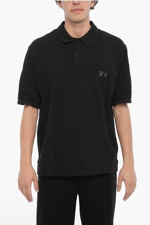 Neil Barrett Effen poloshirt met losse pasvorm en piercingdetail in zwart