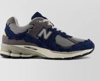 New Balance paneled low-top sneakers