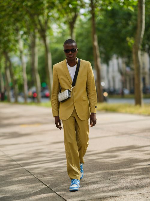 man walking in mustard yellow suit