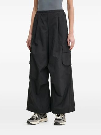 adidas Pantaloni a palazzo con pieghe - Nero