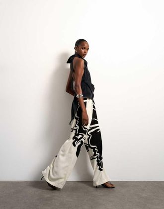 Topshop Pantaloni a fondo ampio in lino &eacute;cru con stampa a fiori-Bianco