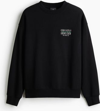 H&M Bedrucktes Sweatshirt in Loose Fit - Schwarz