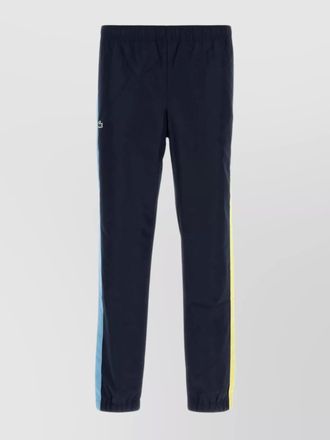 Lacoste joggers with elastic cuffs and side stripes