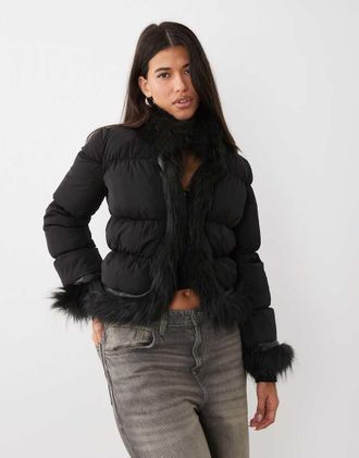 I.AM.GIA Billie giacca puffer nera con bordo in pelliccia sintetica e chiusura con gancetti-Nero
