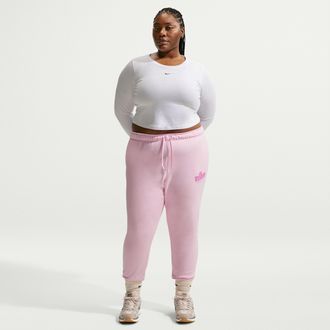 Nike Womens Nike Sportswear Club Fleece Graphic Mid-Rise Pants (Plus Size) in Pink | IO6242-663
