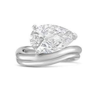 Diana M. Jewels Platinum Lab grown 6.00 ct pear cut diamond ring with a wavy band
