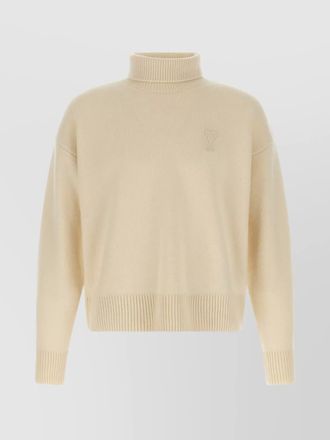 Ami turtleneck sweater featuring long sleeves and ribbed edges
