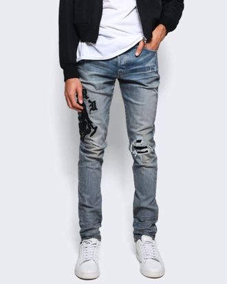 Amiri Wes Lang Reaper Logo Jeans In Clay Indigo