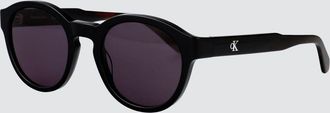 Calvin Klein Jeans Occhiali da sole rotondi in acetato con monogramma