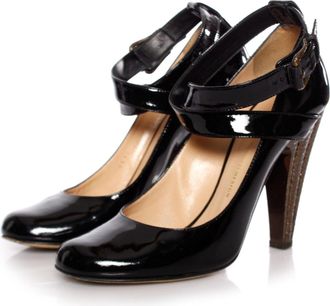 Giuseppe Zanotti Black patent leather pumps with bronze colored heel in size 39