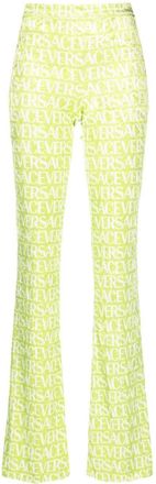 Versace logo-print flared trousers - women - Elastane/Polyester - 42 - Green
