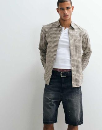 Carhartt Work in Progress pantaloncini di jeans Landon loose tapered con effetto schizzi di vernice in lavaggio nero destroy