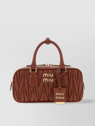 Miu Miu quilted leather handbag padlock detail