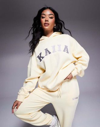 KAIIA cotton blend embroidered logo hoodie in soft yellow and dark gray - part of a set