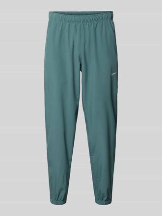 Nike Form Pants mit Logo-Print und Eingriffatschen in Petrol, Gr&ouml;&szlig;e XXL