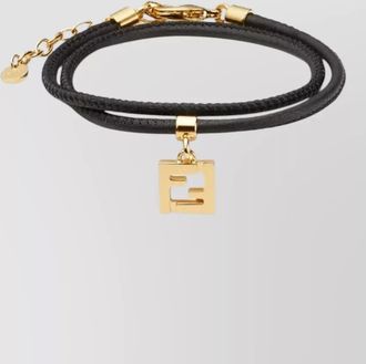 Fendi leather bracelet with gold tone charm