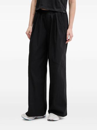 Under Armour Pantaloni a gamba ampia con pieghe - Nero