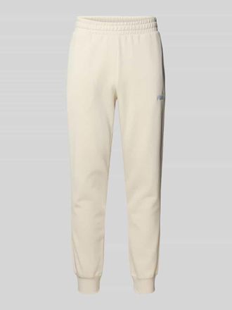Puma Sweatpants mit Label-Stitching und elastischem Bund in Offwhite, Gr&ouml;&szlig;e M