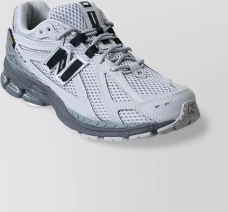 New Balance low top sneakers with mesh upper and rubber outsole