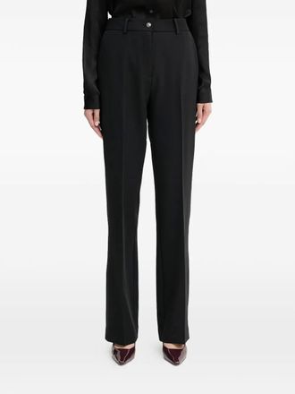 Guess Co button-fastening trousers - Black