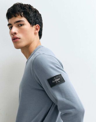 Calvin Klein Jeans felpa con patch in spugna grigia-Grigio