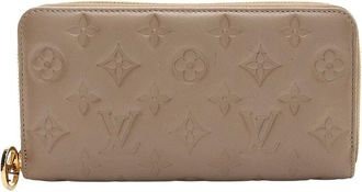 Louis Vuitton Beige Monogram Embossed Coussin Zippy Wallet (Authentic Pre- Loved)