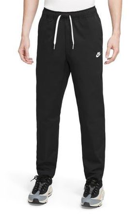 Nike Woven Tapered Leg Pants in Black/White at Nordstrom Rack, Size Medium