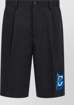 Undercover bermuda shorts with back pockets and graphic print