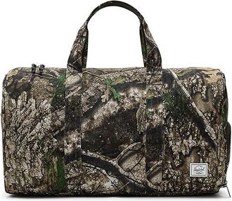 Herschel Realtree(r) Herschel Noveltm Duffle Duffel Bags Realtree Apx Camo, Mesh/Polyester/Vinyl