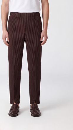 Homme Pliss&eacute; Issey Miyake Pantaloni slim fit Homme Pliss&eacute; Issey Miyake in tessuto tecnico plissettato con spacco