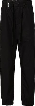 Versace Jeans Couture logo-strap tapered-leg trousers - men - Cotton/Cotton - 50 - Black