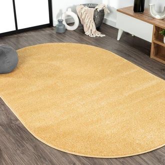 Jonathan Y Designs Haze Solid Low-Pile Oval Area Rug in Yellow/amber at Nordstrom, Size 4Ft 0In X 6Ft 0In