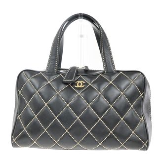 Chanel Surpique Boston Bag Quilted Leather Black Leather Handbag (Pre-Owned)