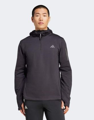 adidas adidas Performance - Own The Run - Felpa invernale nera con cappuccio e zip corta-Nero
