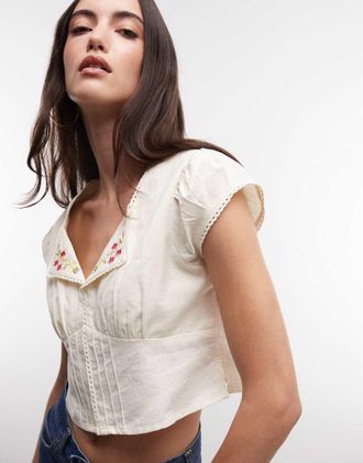 Reclaimed Vintage Camicia corta color crema con colletto e ricamo floreale-Bianco