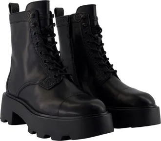 Tory Burch Womens Monogram-Embossed Lug Sole Ankle Boot Black Calfskin